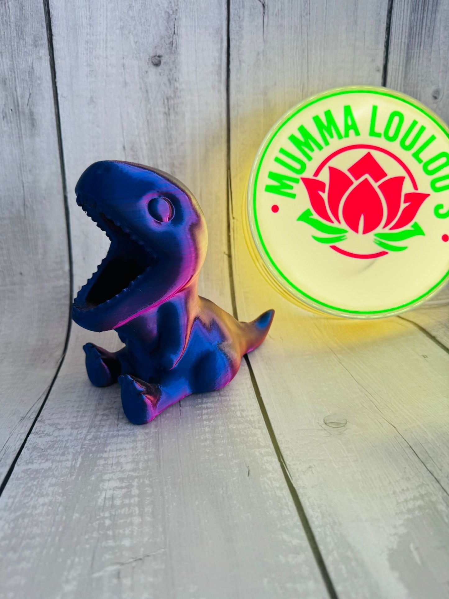 3D Printed Dinosaur Pen Pot in red/purple silk PLA on desk