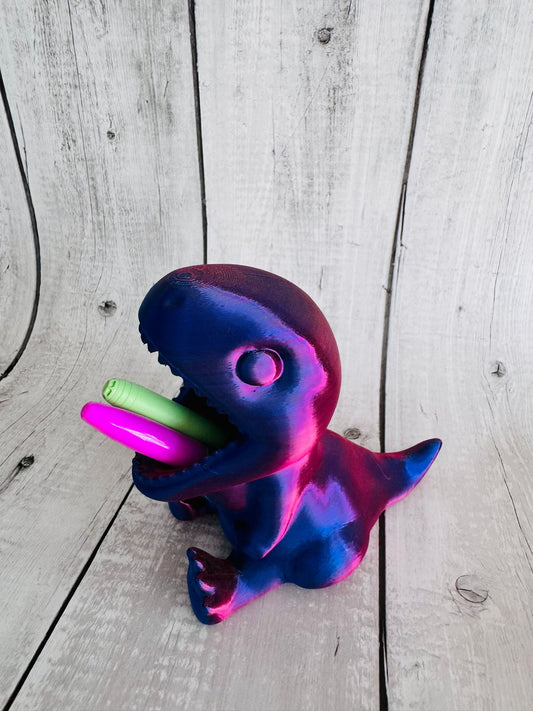 Close-up of dinosaur pen holder with pencils